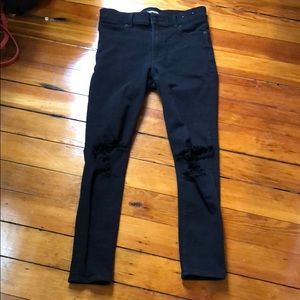 Black Express jeans with knee rips